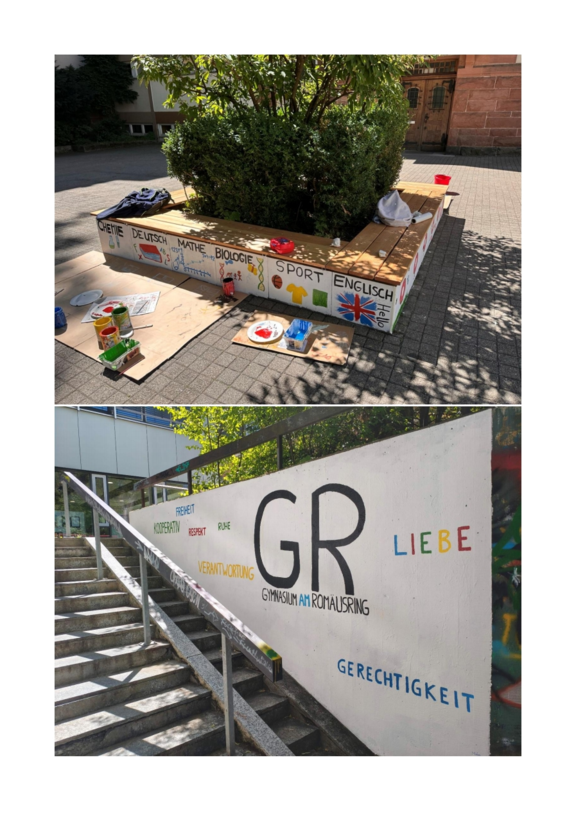 Eine Sitzbank mit bunten Malereien von Fächern und Symbolen, daneben eine Wand mit den Worten Freiheit, Respekt und Liebe.